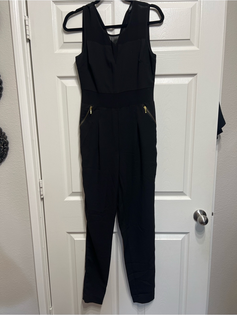 XOXO Black Sleeveless V-Neck Jumpsuit with Gold Zipper Details